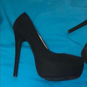 Black platform pumps